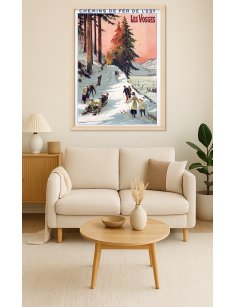 Affiche rétro "Les Vosges" de Louis Tauzin encadrée dans un intérieur décoratif sur le thème hivernal